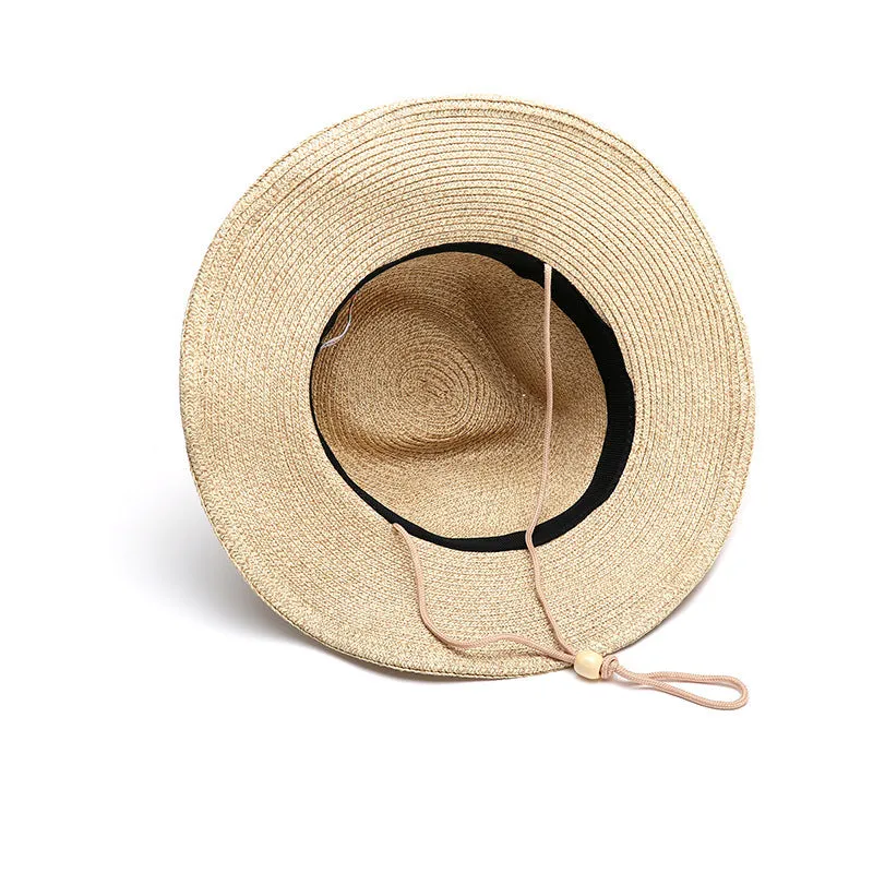 Men's foldable wide-brim straw sun hat in beige, shown on a neutral background.