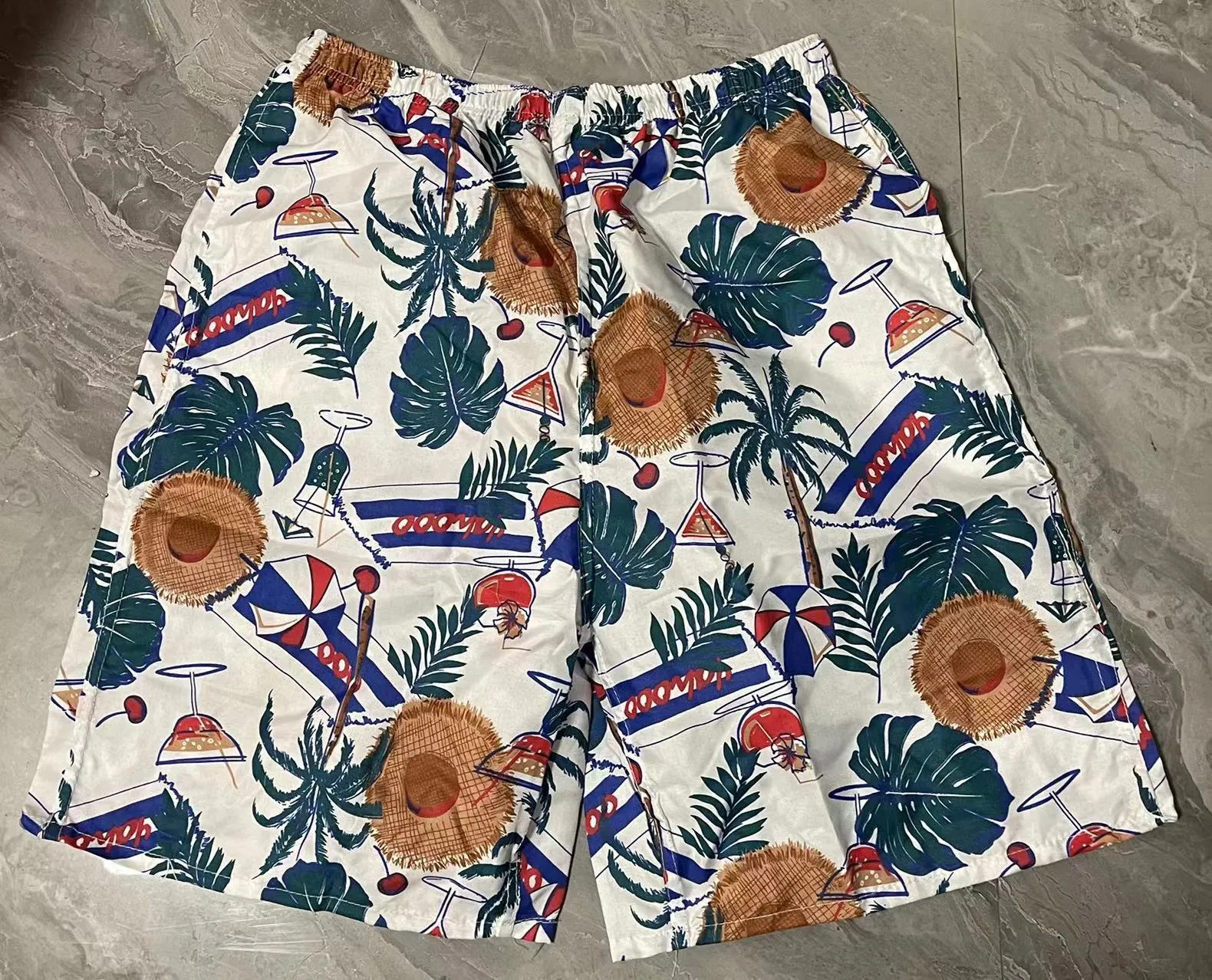 Men's floral printed swimming trunks with five-point design in polyester fabric