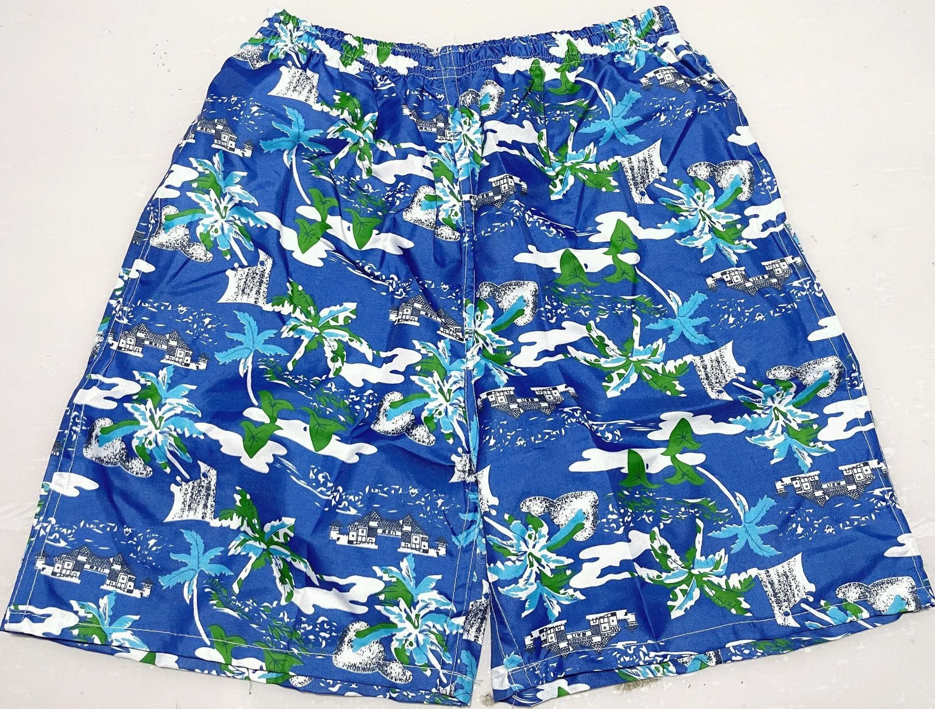 Men's floral printed swimming trunks with five-point design in polyester fabric
