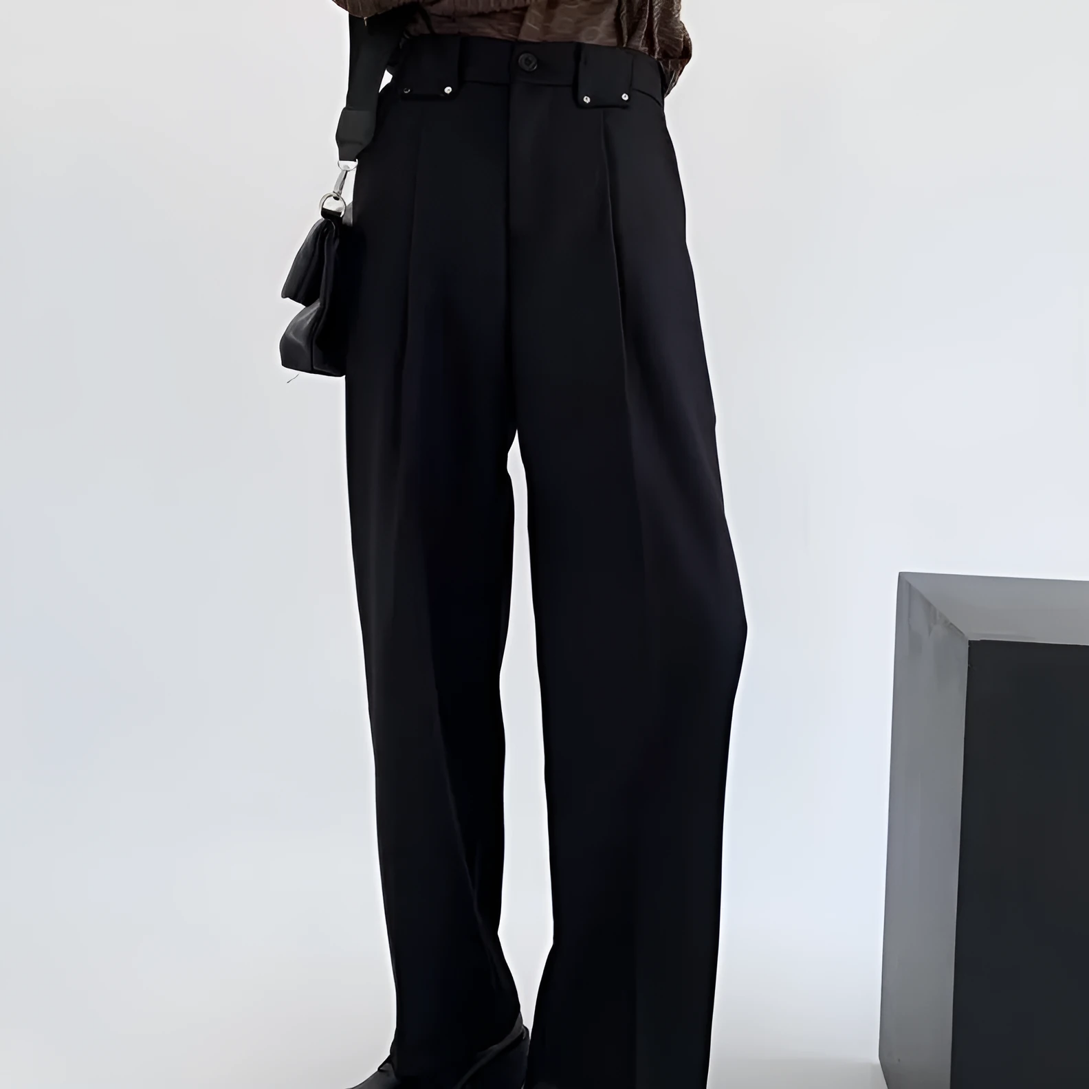 Women's black high-waisted cropped suit pants with draping effect, sizes M-3XL, on display