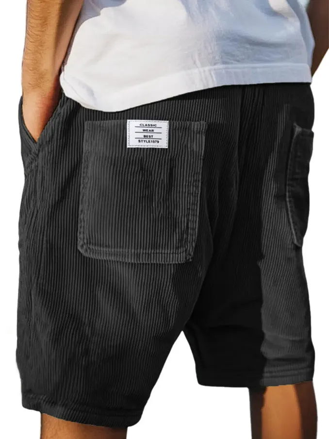 Men's straight cut multi-pocket corduroy shorts in grey shown on a hanger.