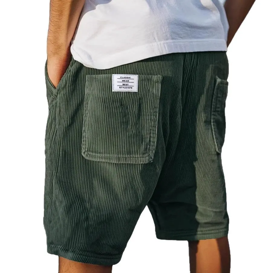 Men's straight cut multi-pocket corduroy shorts in grey shown on a hanger.