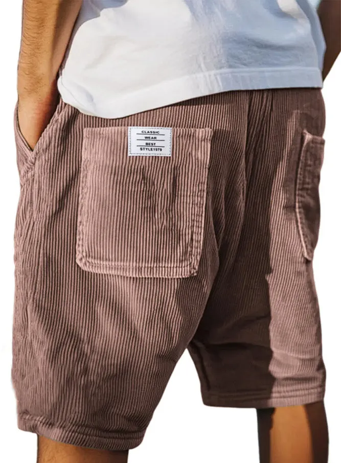 Men's straight cut multi-pocket corduroy shorts in grey shown on a hanger.