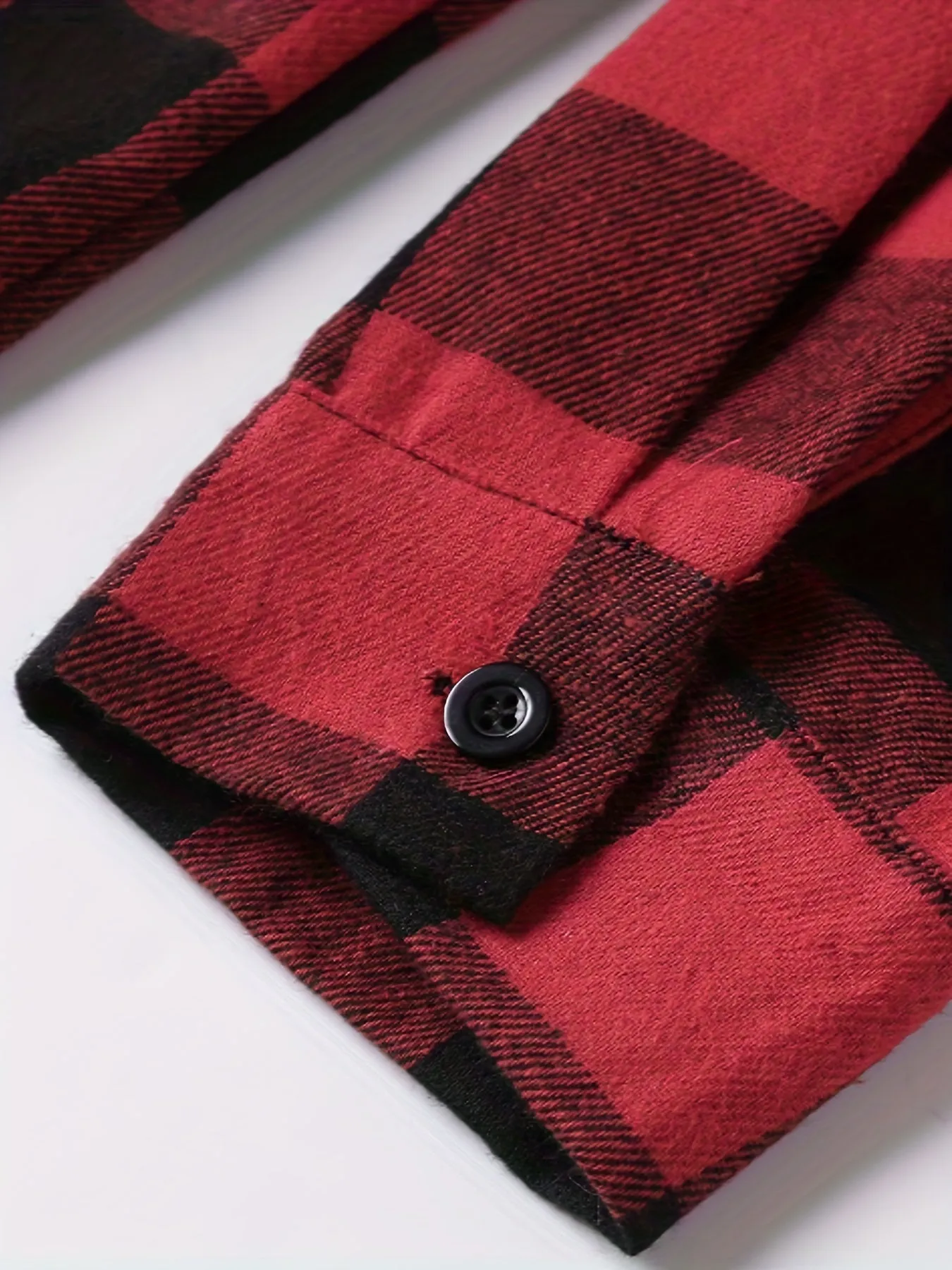 Teenage men's red and black checked long-sleeved casual shirt with button-front closure