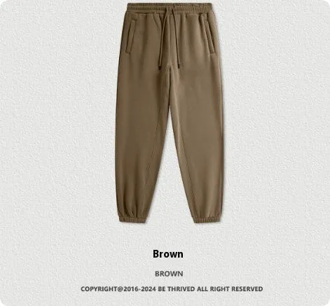 Men's solid colour cotton velvet sweatpants with elastic waist and ankle banding detail