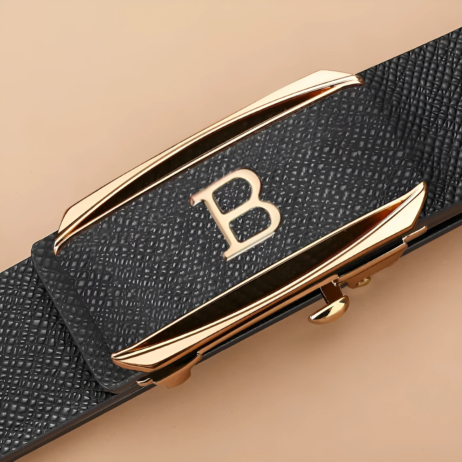Genuine leather automatic buckle belt with alloy buckle, black gold finish, on display