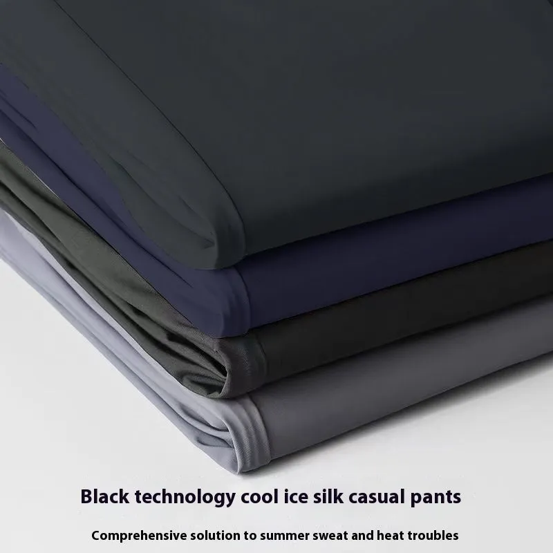 Man wearing black ice silk straight-leg loose casual trousers with an elastic waist.