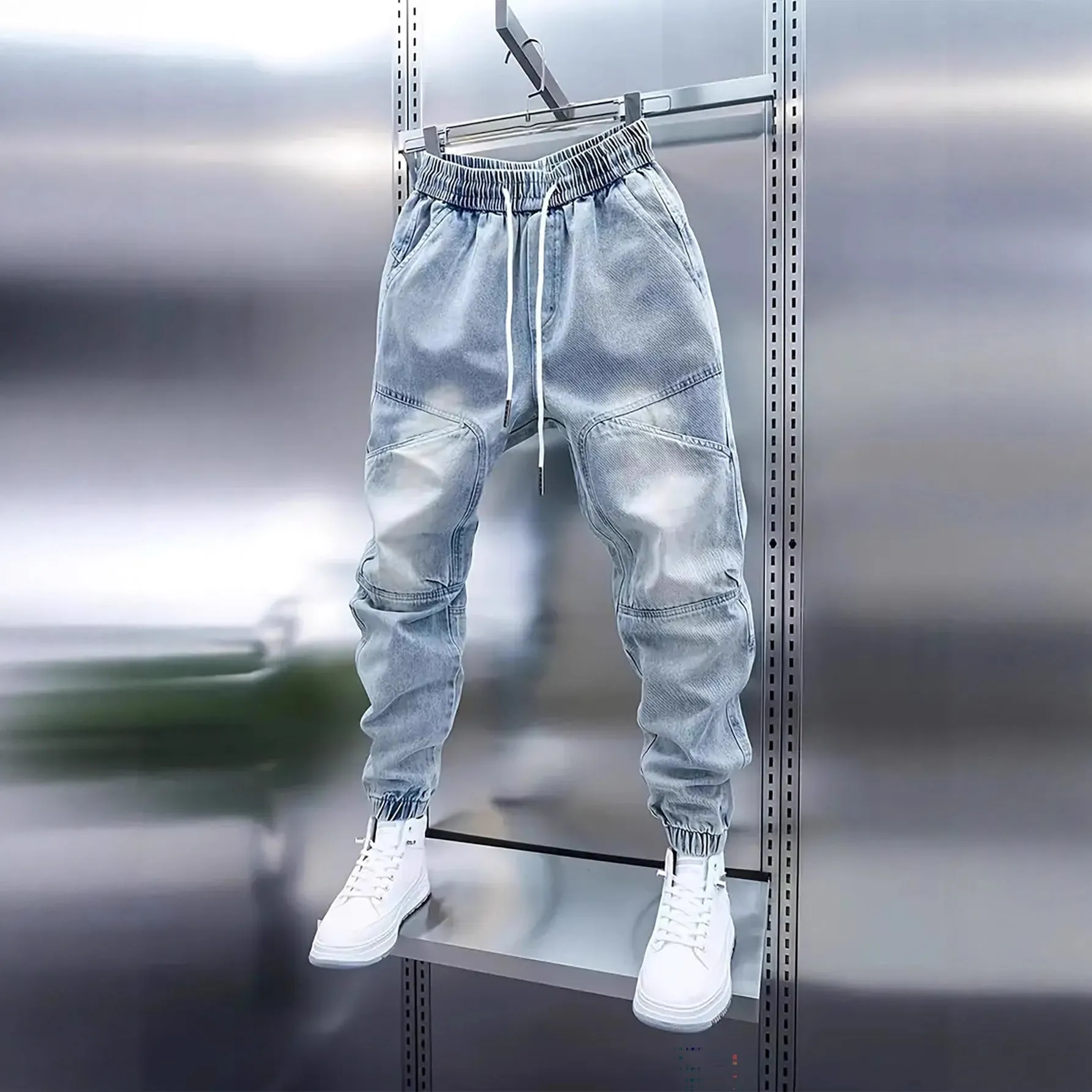 Men's light blue denim pencil pants with elastic ankle bands and drawstring mid waist