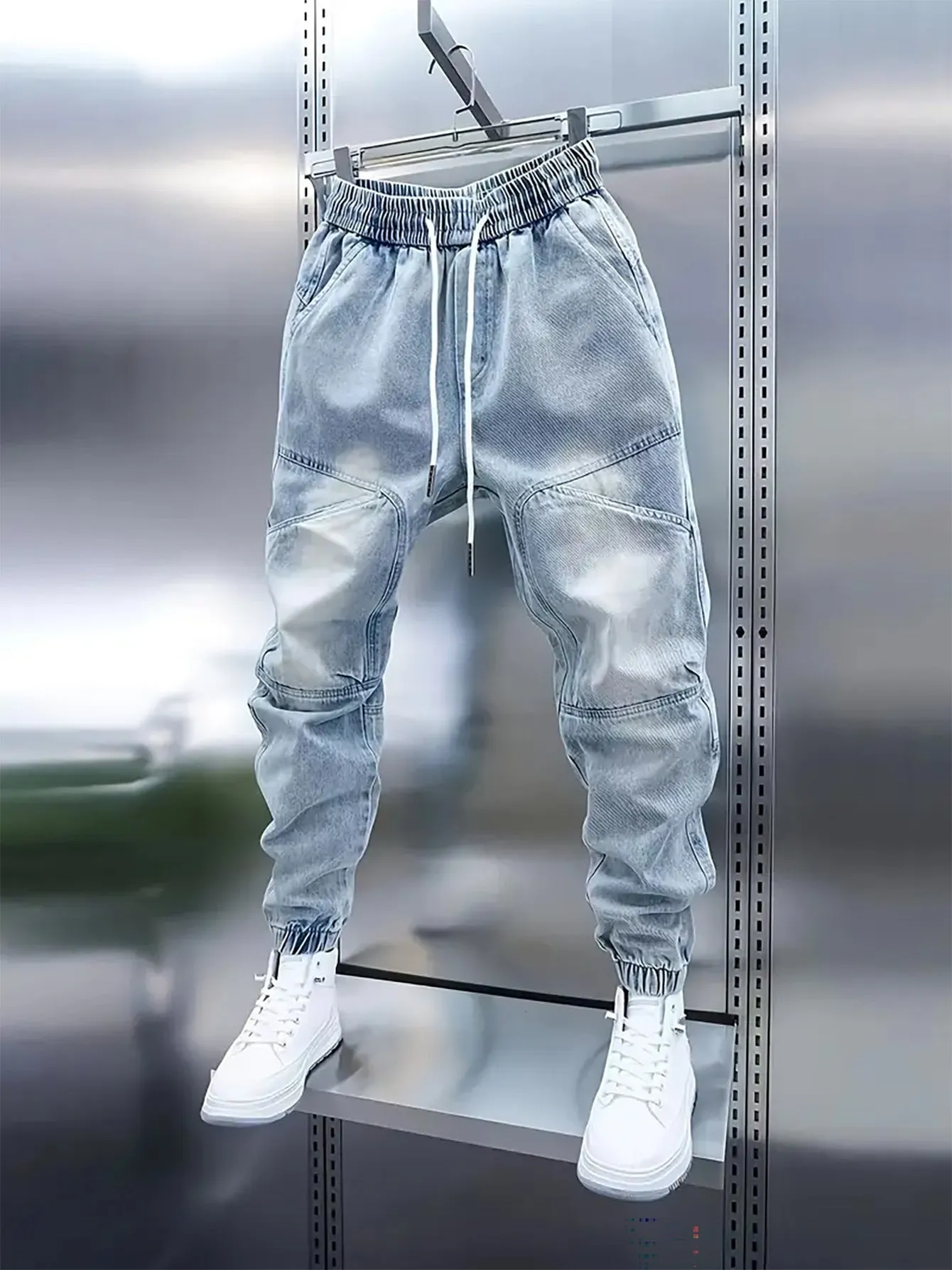 Men's light blue denim pencil pants with elastic ankle bands and drawstring mid waist