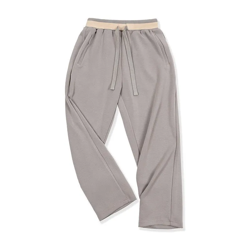 Casual loose-fit anti-wrinkle polyester sweatpants for men in dark blue, grey, or light brown
