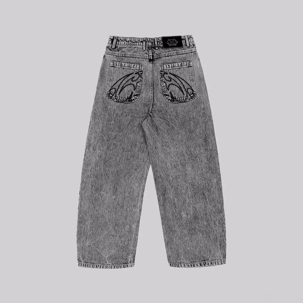 Grey loose straight-leg denim trousers for men and women laid flat, showing mid waist and classic cut.