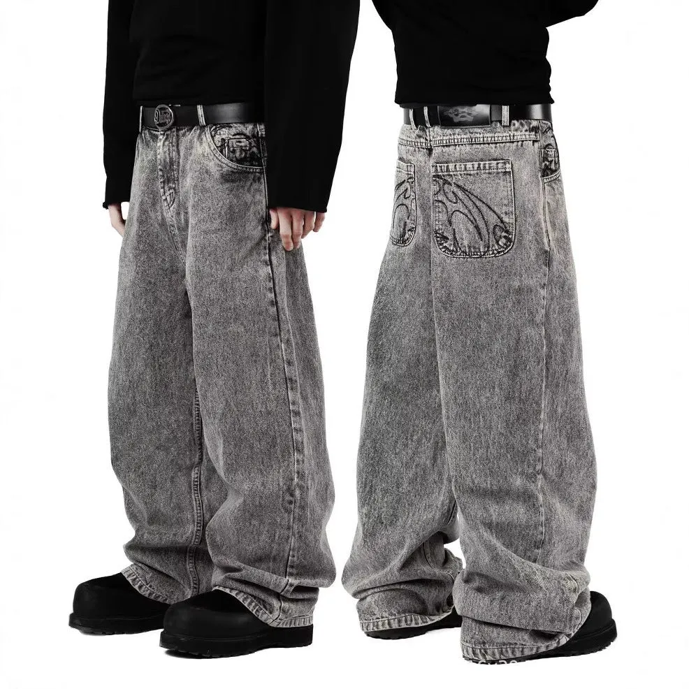 Grey loose straight-leg denim trousers for men and women laid flat, showing mid waist and classic cut.