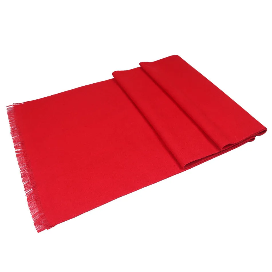 Men's solid red double-sided velvet scarf with tassel ends on a neutral background