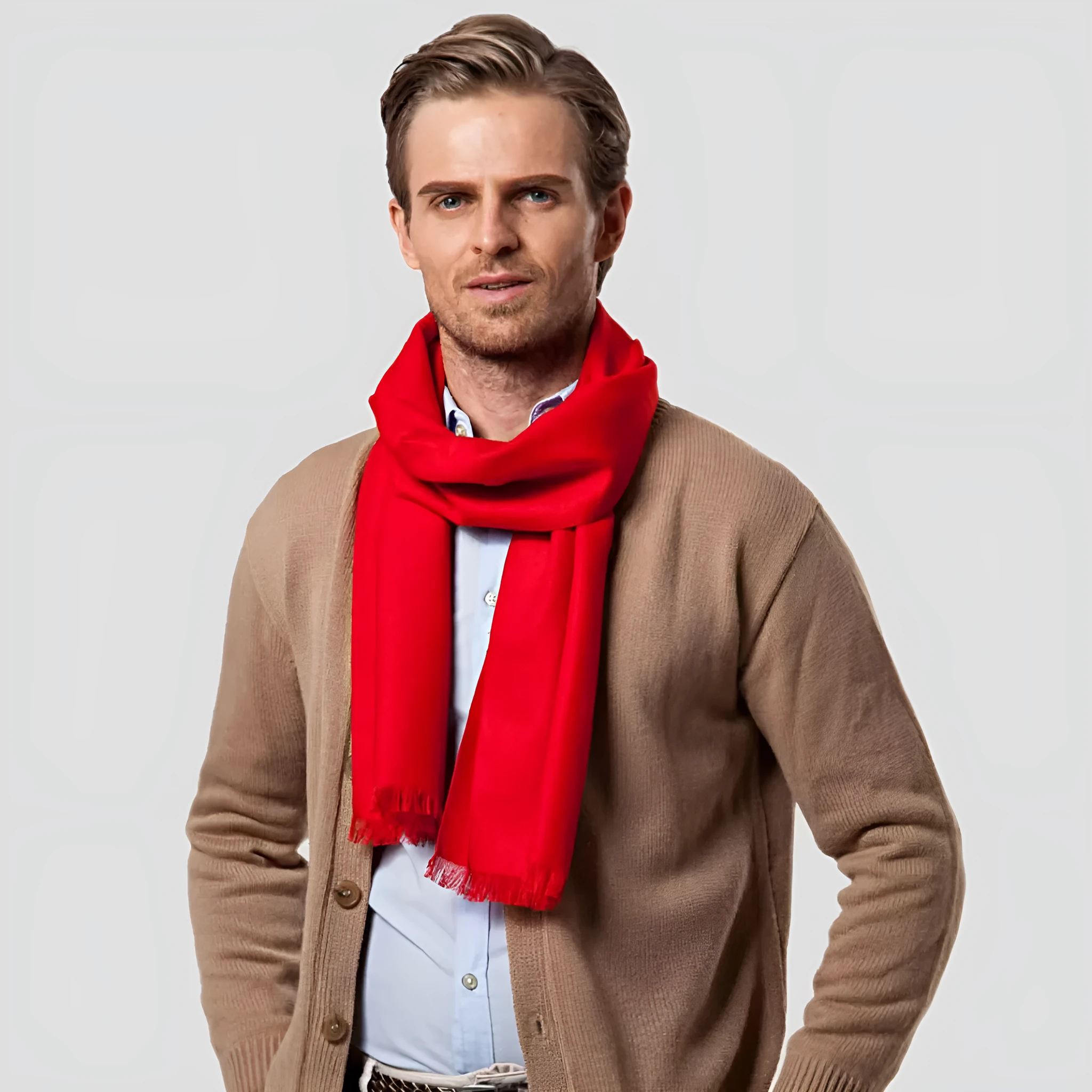Men's solid red double-sided velvet scarf with tassel ends on a neutral background