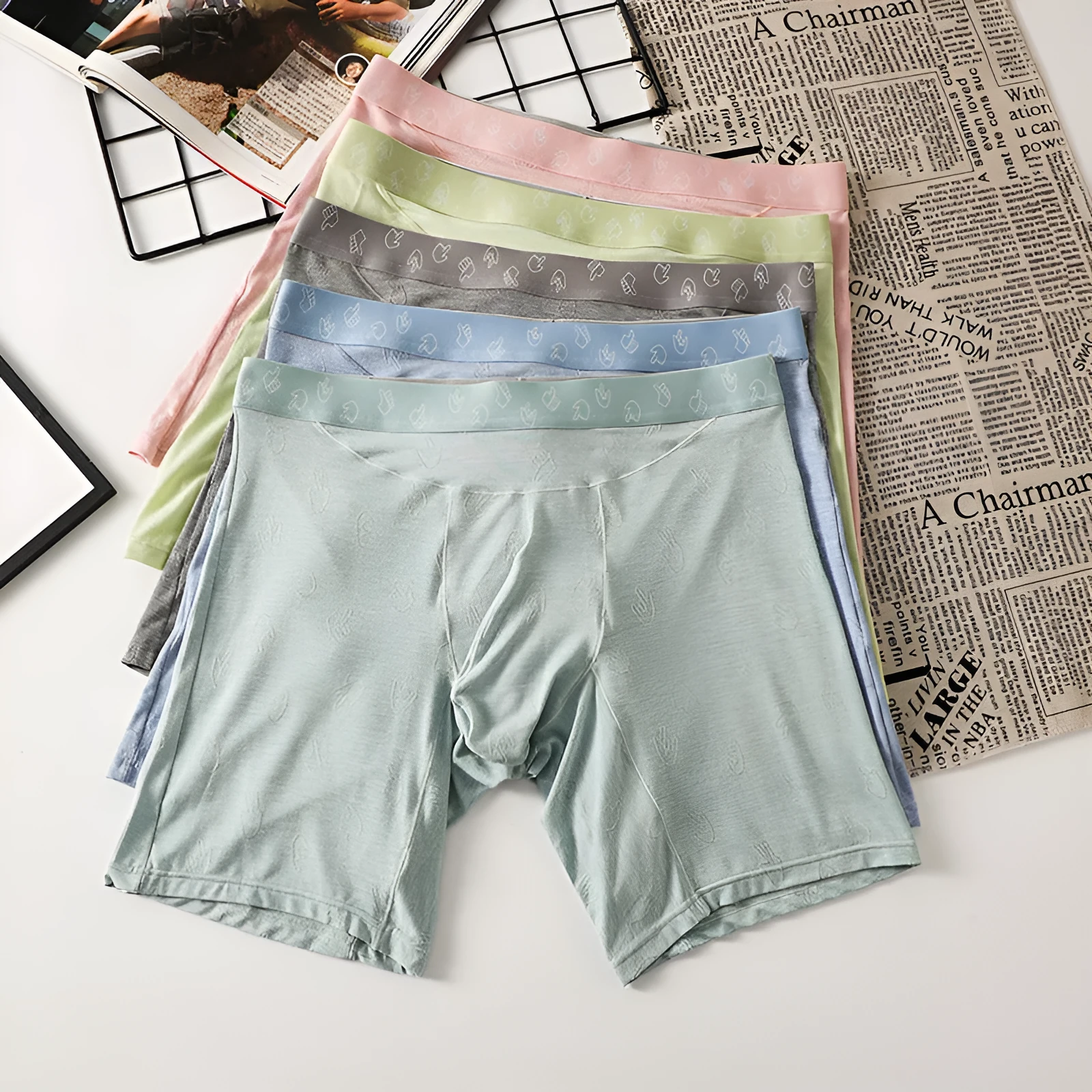 Men's lengthened modal ice silk boxer shorts with hip lifting in blue, front view