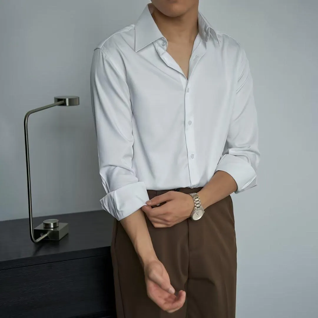 Man wearing a black Japanese retro style loose fit cardigan shirt with long sleeves.
