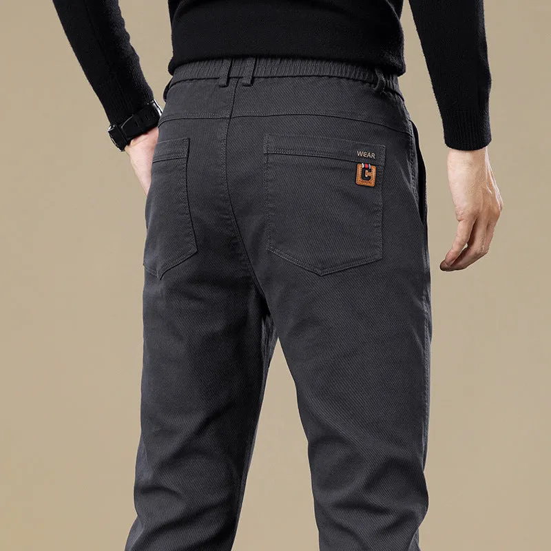 Men's fleece-lined slim fit tapered casual pants in black cotton fabric with straight leg