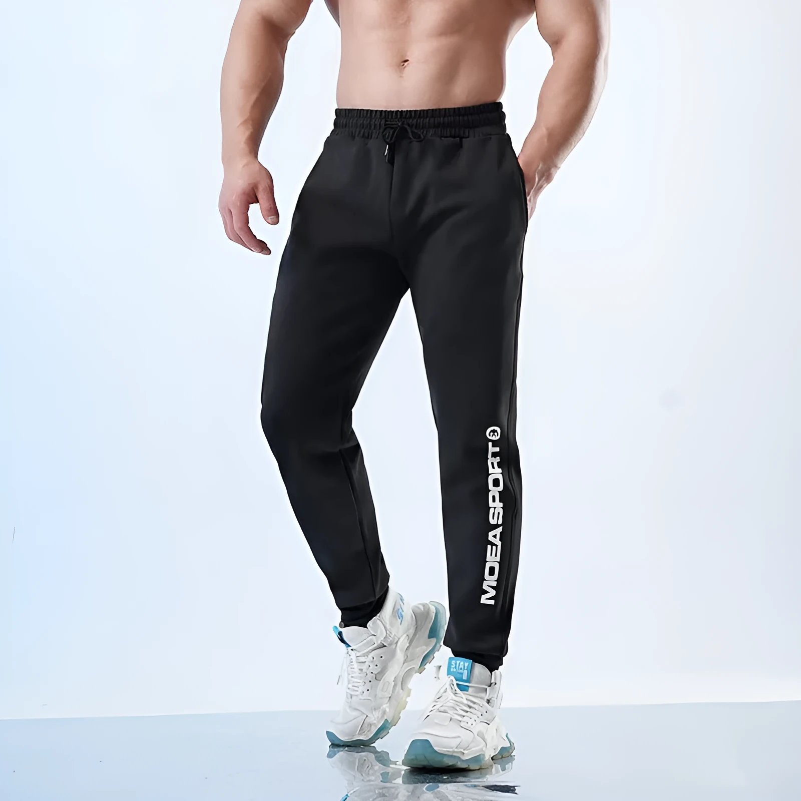 Men's black ankle-tied sweatpants with mid waist design for casual sports wear