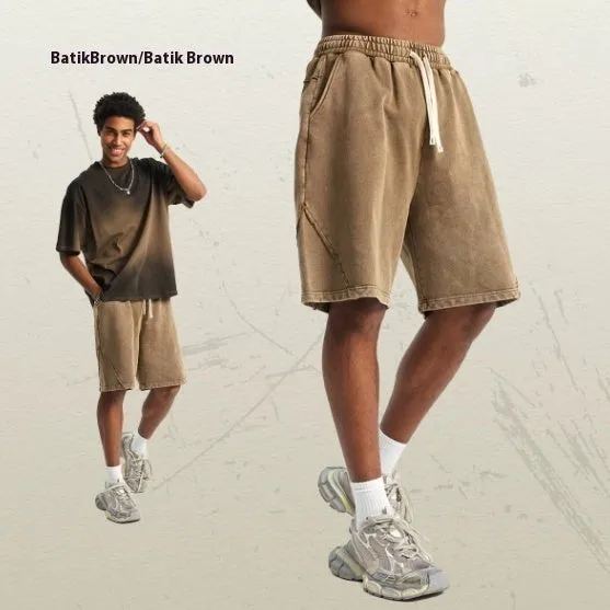 Men's batik washed cotton terry shorts in loose street fashion style showing colour variations