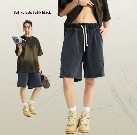 Men's batik washed cotton terry shorts in loose street fashion style showing colour variations