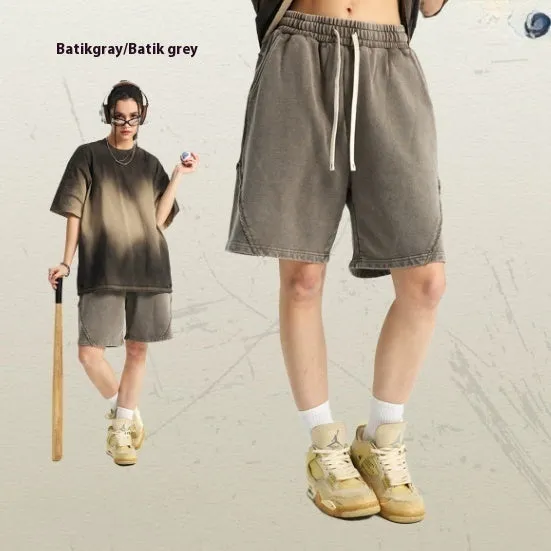 Men's batik washed cotton terry shorts in loose street fashion style showing colour variations