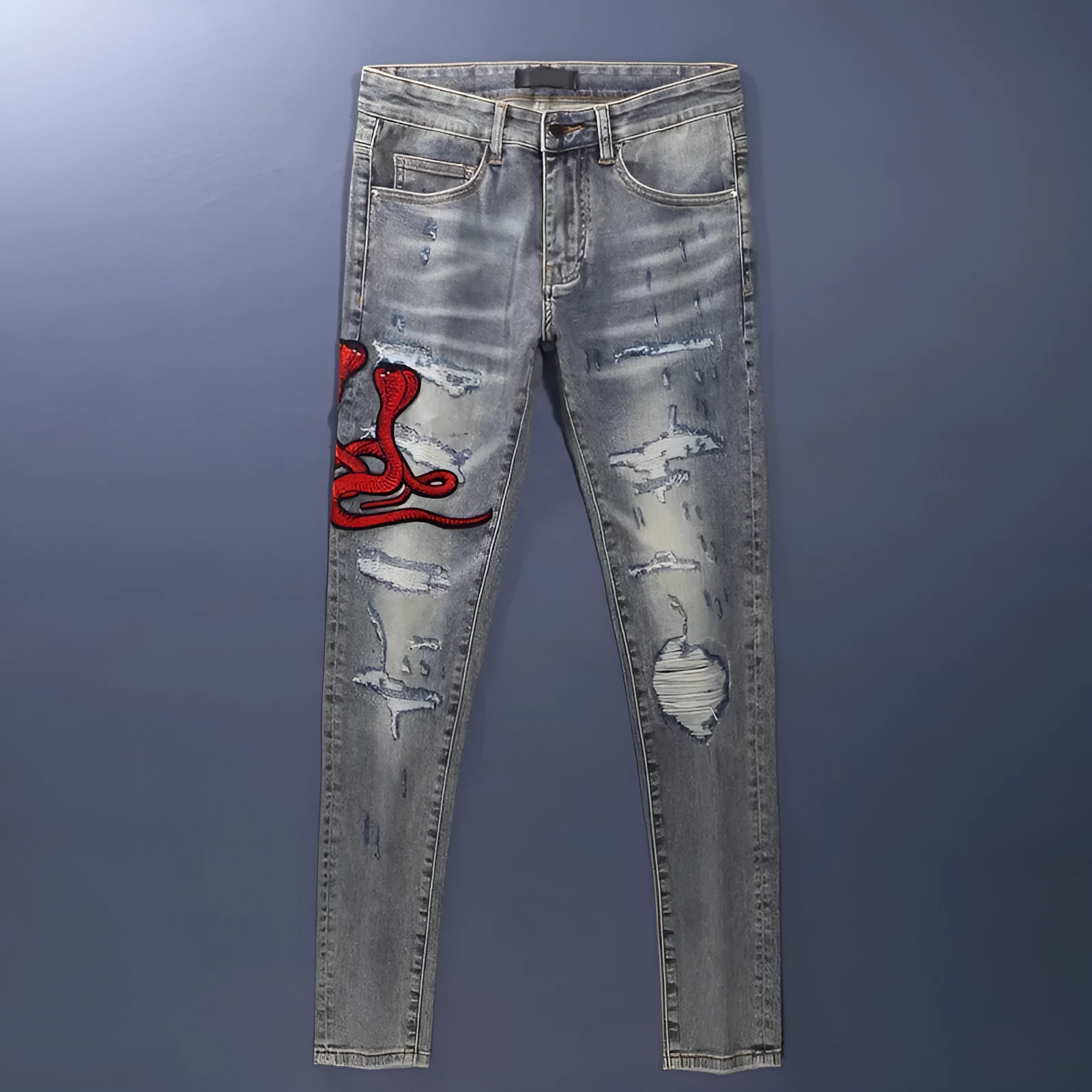 Men's slim fit jeans with embroidered patches and worn wash effect in old colour