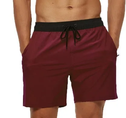 Men's blue stitching waist training shorts with zipper pockets and a drawstring, laid flat.