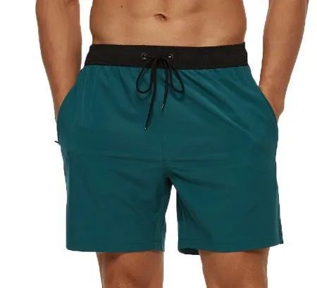 Men's blue stitching waist training shorts with zipper pockets and a drawstring, laid flat.