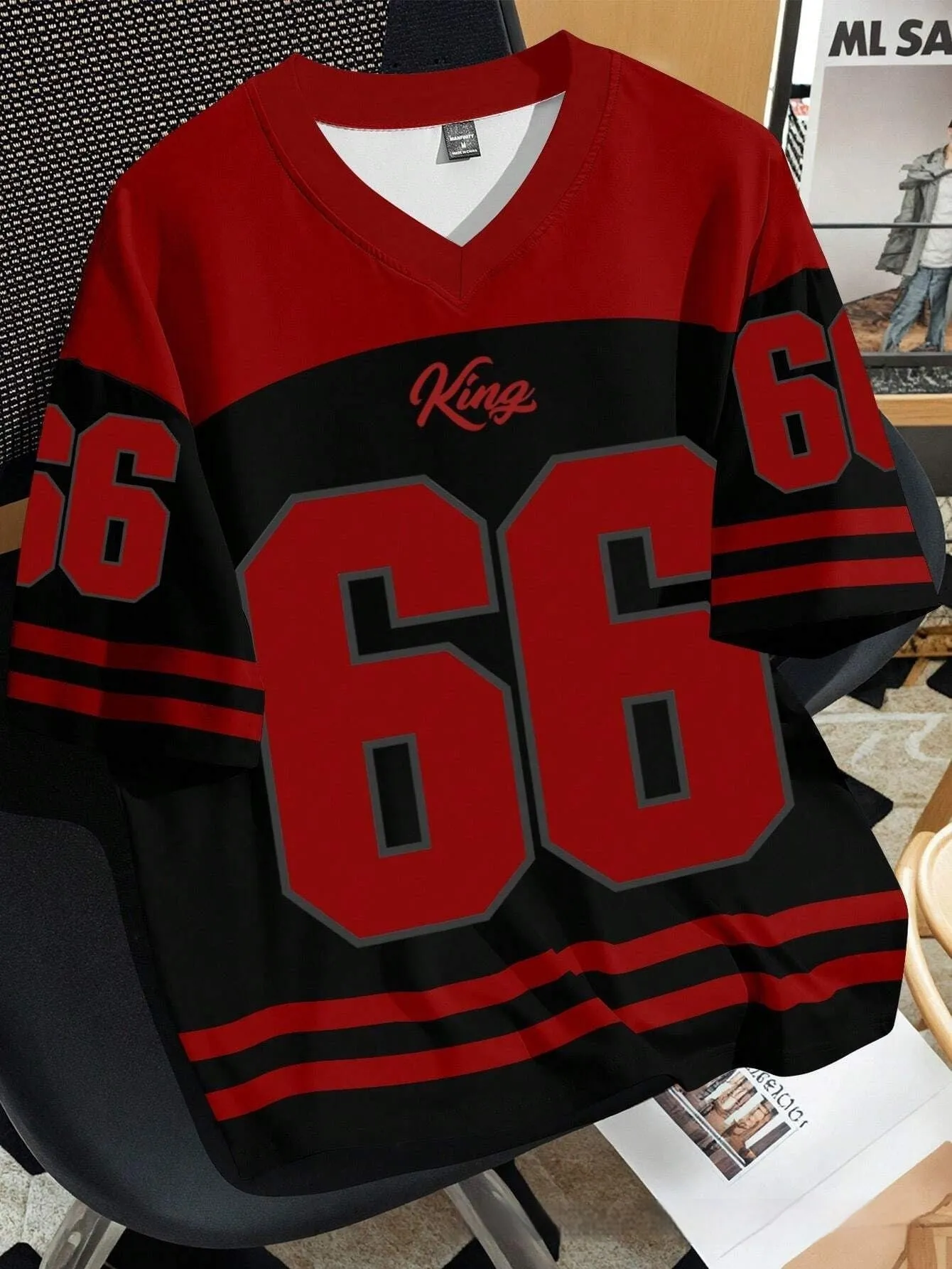Man wearing a loose grey T-shirt with a large, detailed 3D printed Chicago No 23 graphic on the front.