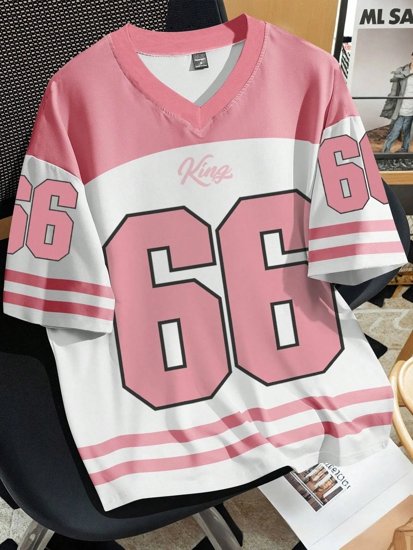 Man wearing a loose grey T-shirt with a large, detailed 3D printed Chicago No 23 graphic on the front.