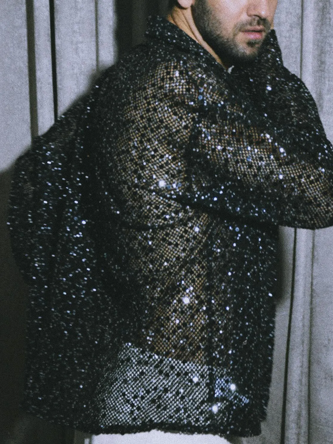 Black sequin sheer open-front shirt with oversized silhouette on display