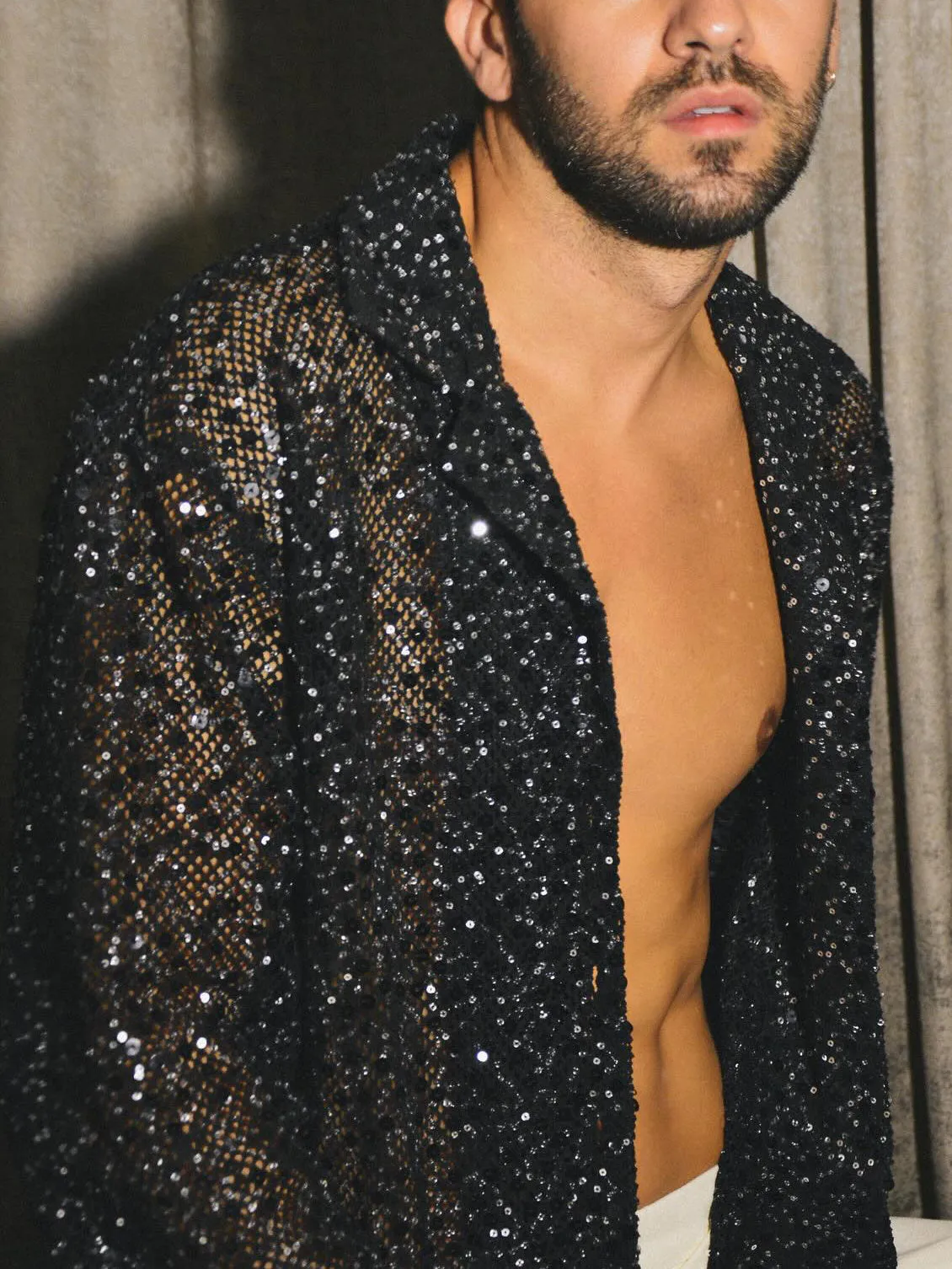 Black sequin sheer open-front shirt with oversized silhouette on display