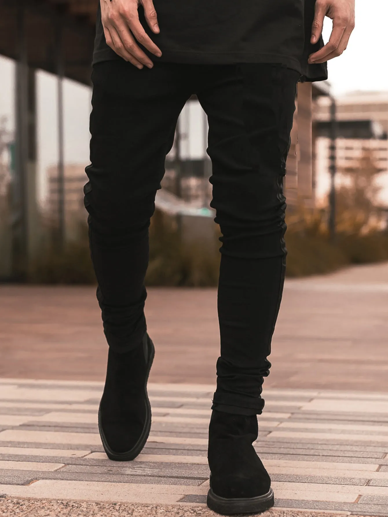 Men's ripped black slim-fit high waist cotton denim trousers with elastic waist