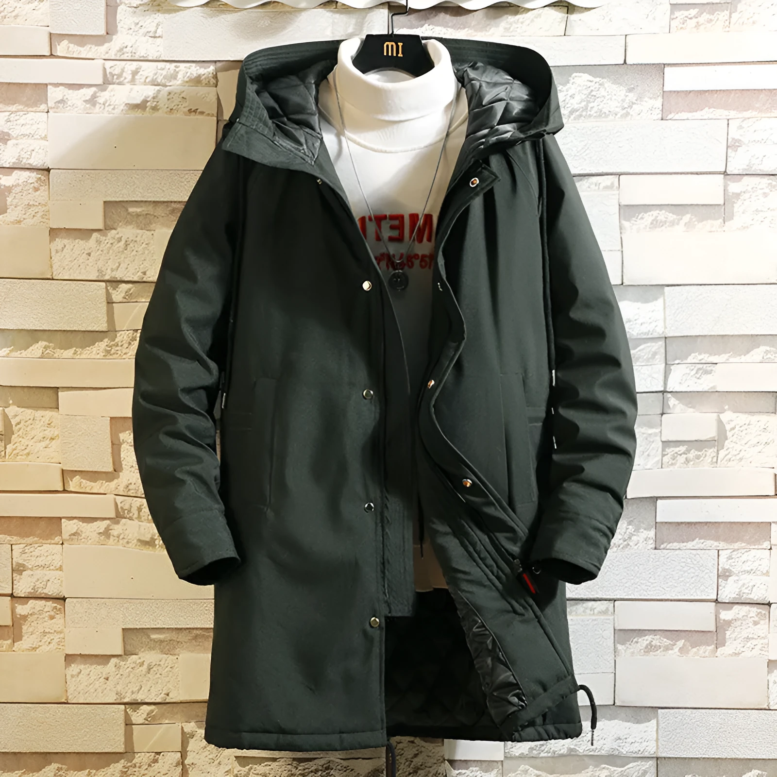 Men's hooded mid-length polyester coat in black with acetate lining on male model