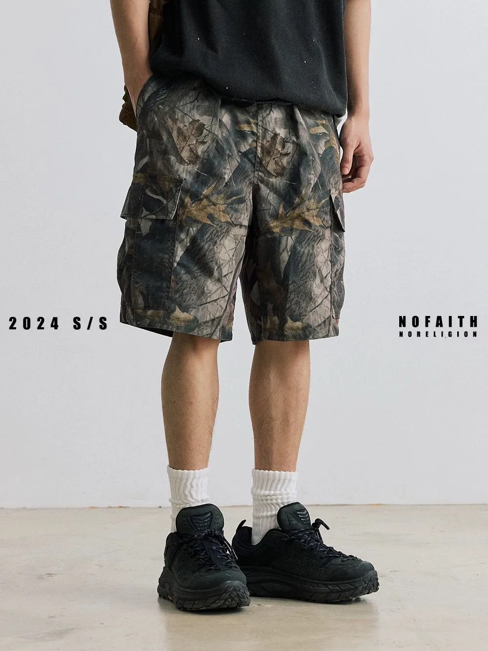 Men's loose fit denim shorts in army green with an elasticated waistband and straight leg.