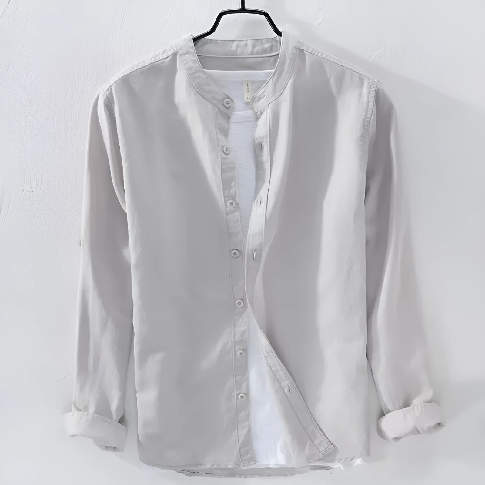 A man's loose-fitting, long-sleeve casual shirt in a cotton linen blend, shown in a solid colour.