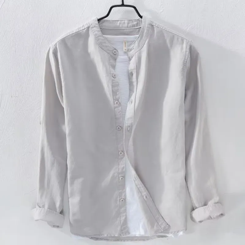 A man's loose-fitting, long-sleeve casual shirt in a cotton linen blend, shown in a solid colour.