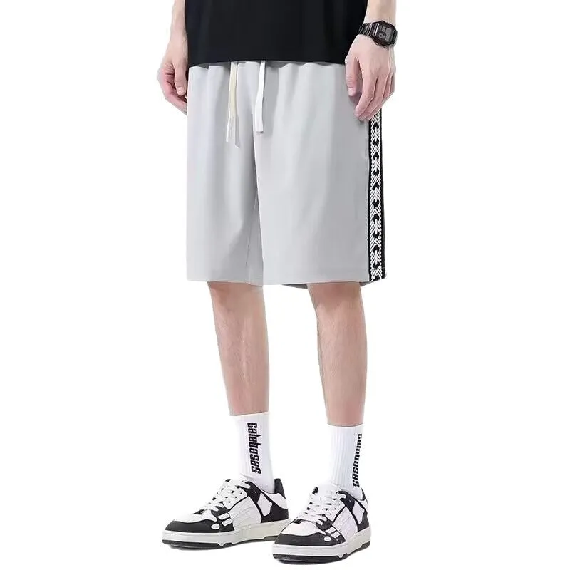 Men's loose fit baggy track pants in black, light grey, and dark grey colours with micro elastic fabric