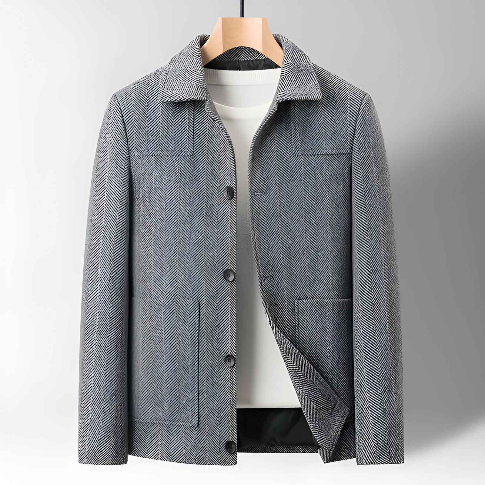 Men's slim lapel woolen jacket in gray with non-ironing finish and side patch pockets on a plain background