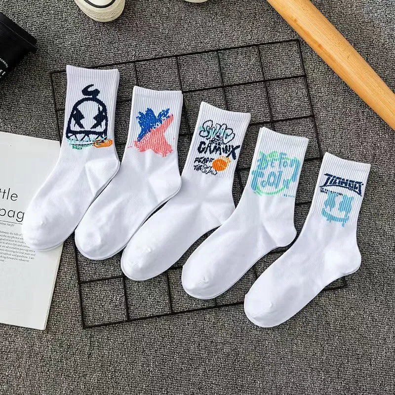 White cotton tube socks with graffiti pattern and middle calf length on plain background