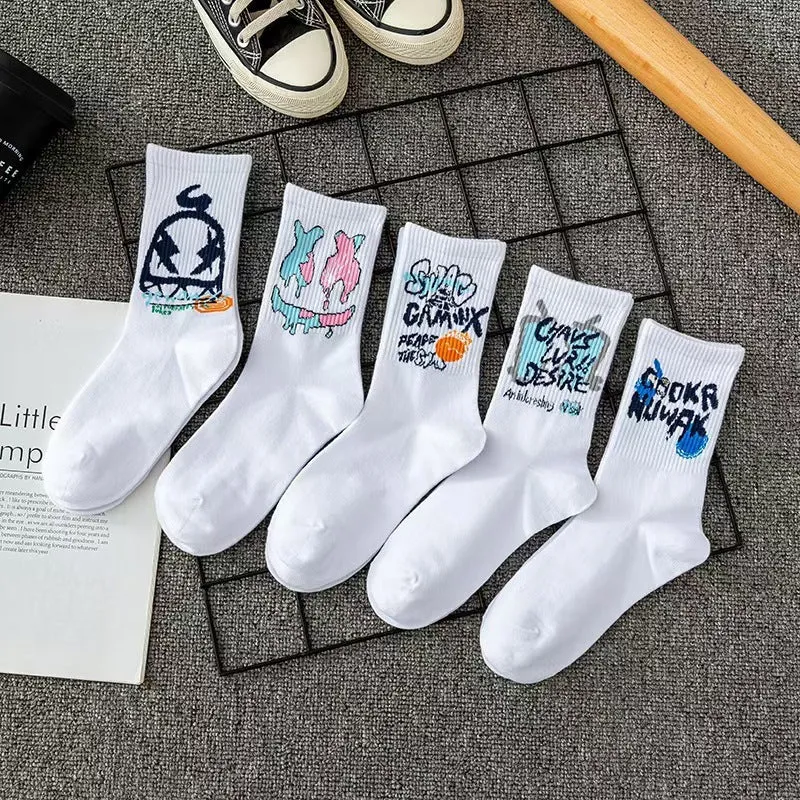 White cotton tube socks with graffiti pattern and middle calf length on plain background