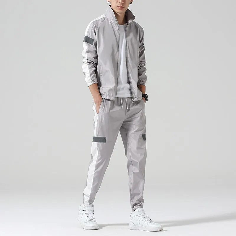 Men's polyester sportswear suit with stand collar jacket and loose fit trousers in black