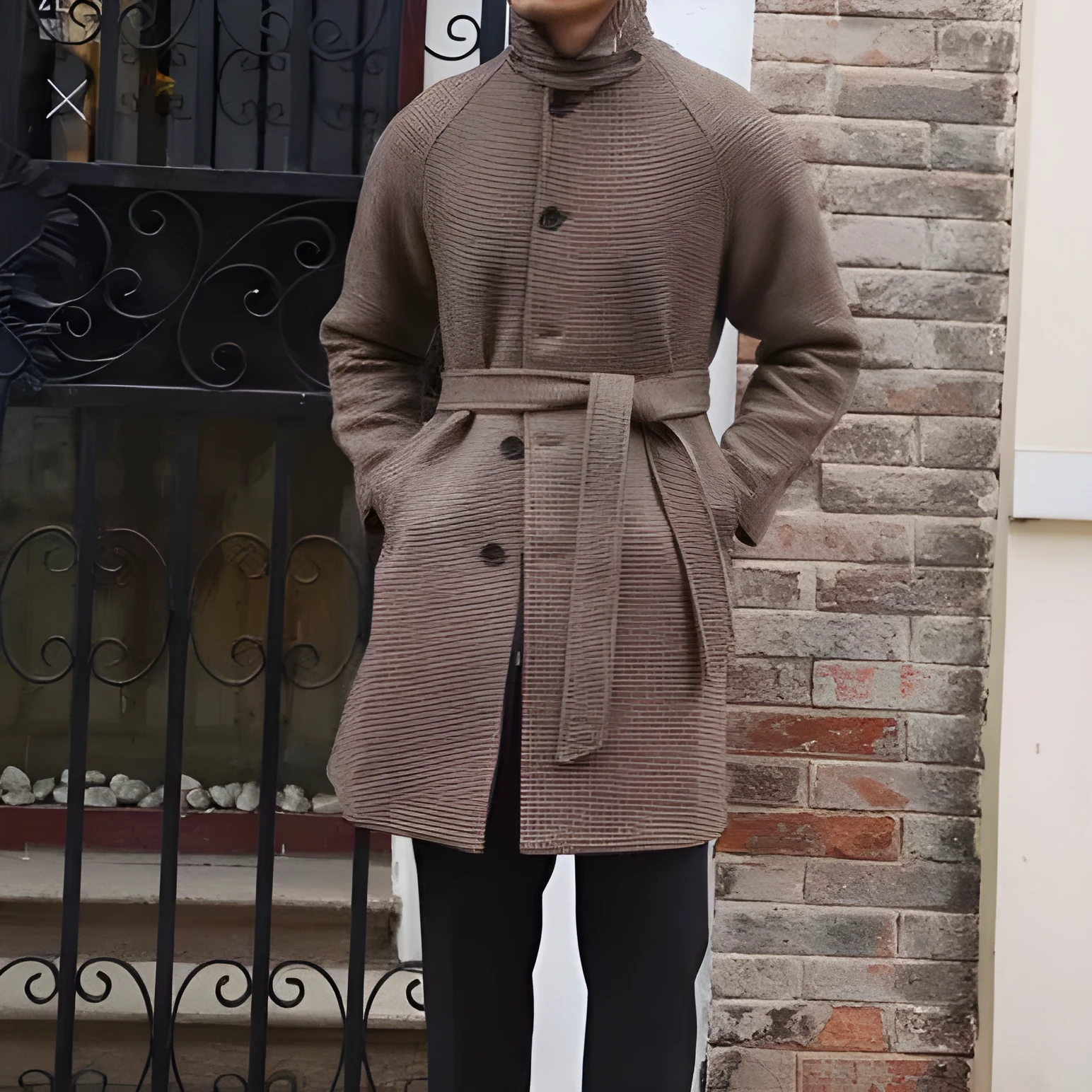 Mid-length brown wool coat with shoulder insert on a hanger, leisure style with structured shoulders