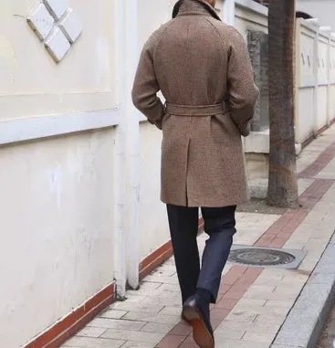Mid-length brown wool coat with shoulder insert on a hanger, leisure style with structured shoulders