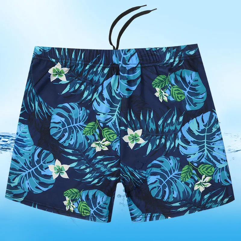 Men's loose-fit polyester swim trunks in dark blue with large flower print, three sizes available