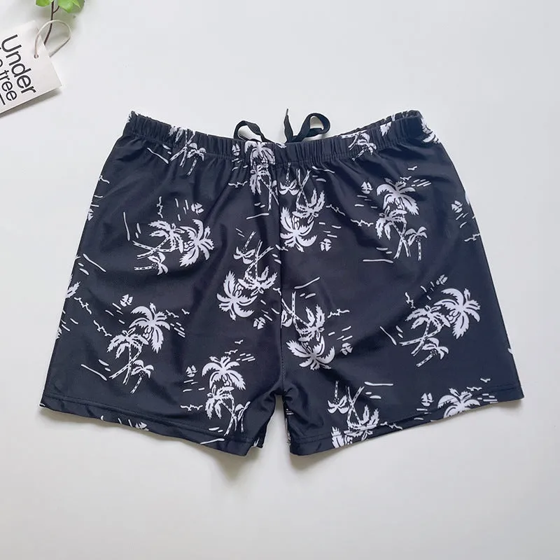 Men's loose-fit polyester swim trunks in dark blue with large flower print, three sizes available