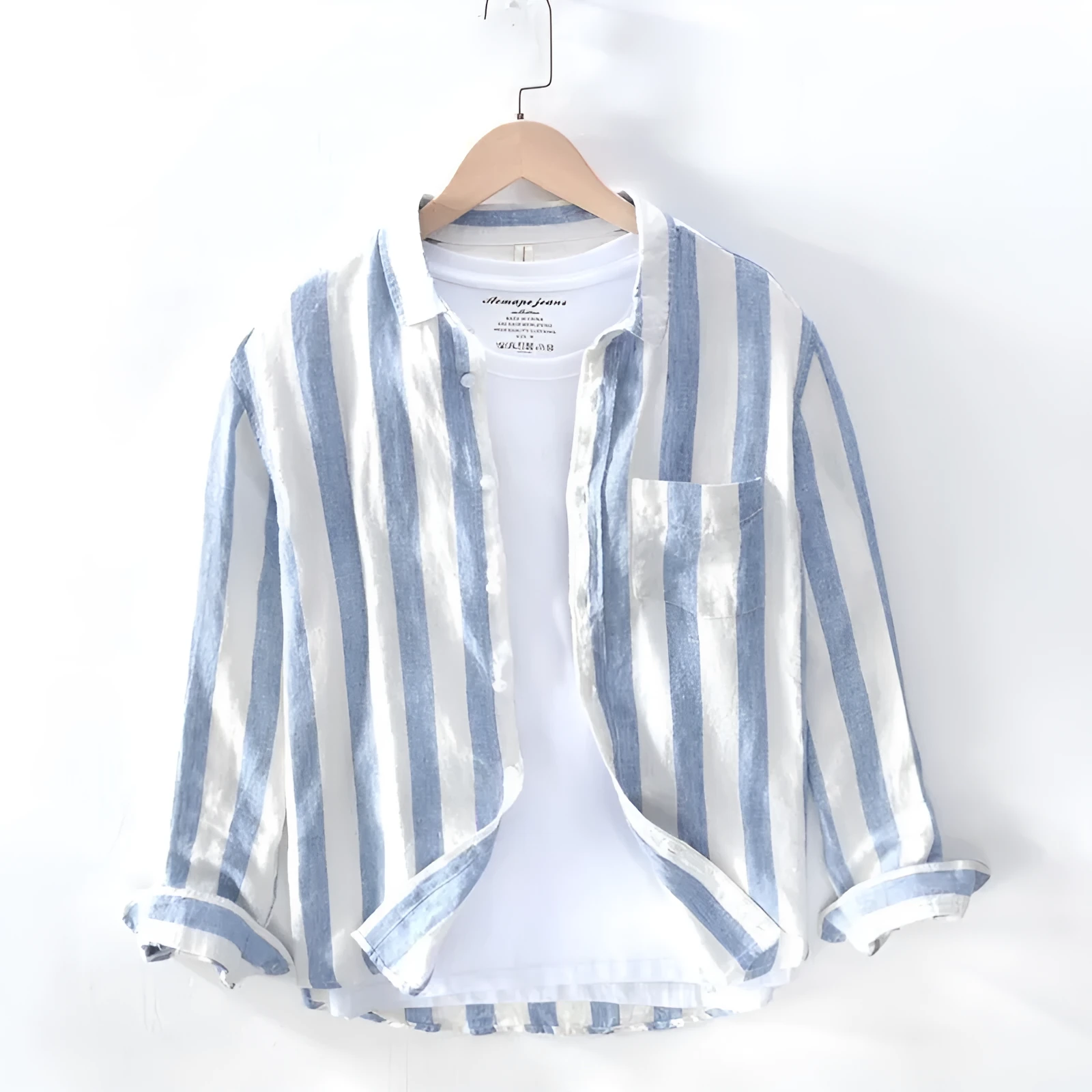 Blue long sleeve Hong Kong style loose fit men's casual shirt on a hanger.