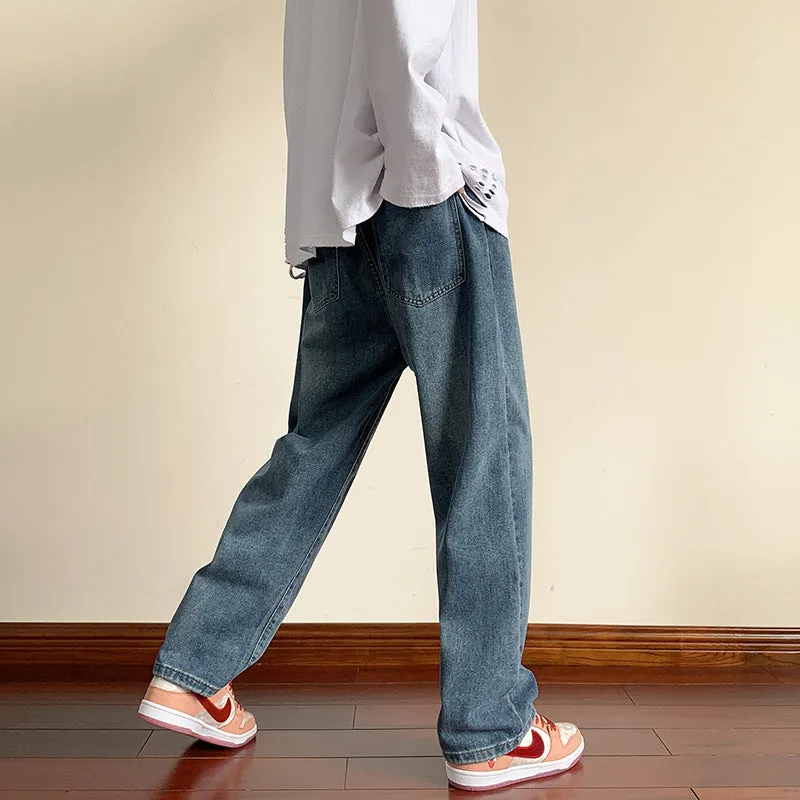 Men's loose cotton sports jeans in retro blue with zipper fly, side view on model