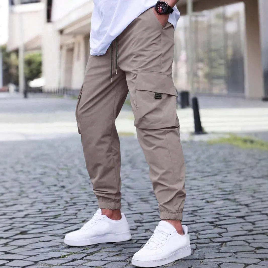 Workwear casual pants with drawstring elastic waist, solid colour, polyester fibre, skinny leg, black colour option
