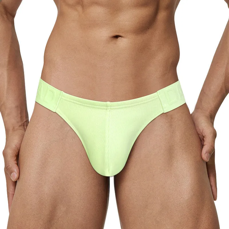 Polyester national triangle low waist seamless briefs in six colours – black, white, pink, purple, green, yellow – on white background